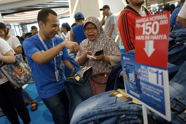 Aksi DANA Dorong Transaksi Nontunai di Bisnis Offline